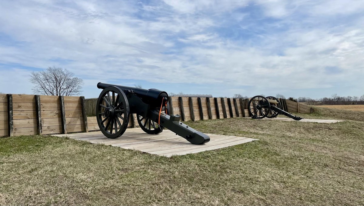 2 cannons at an earthen fort
