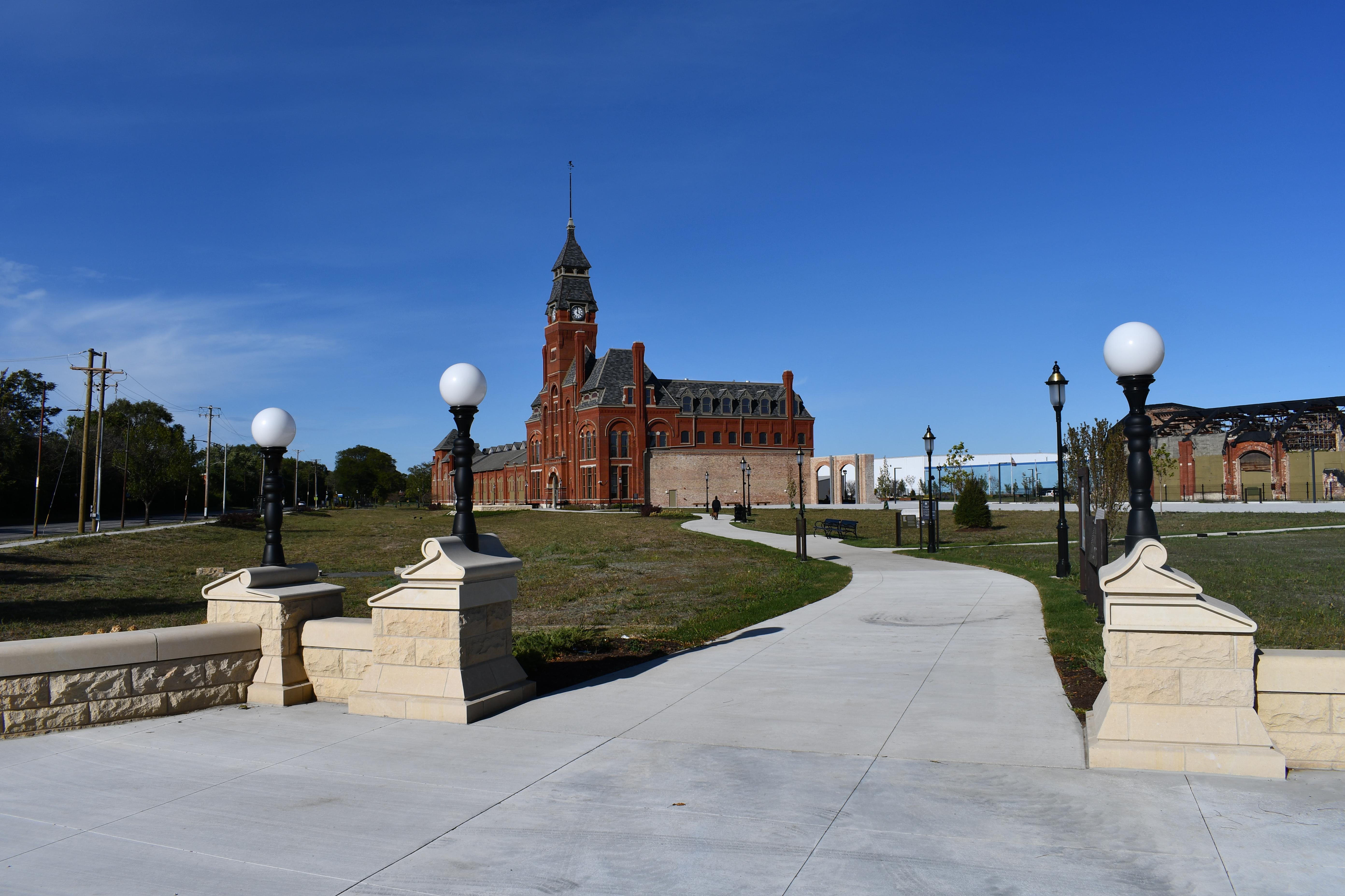 Clock Tower and Administration Building with a walkway leading up to the front of it.