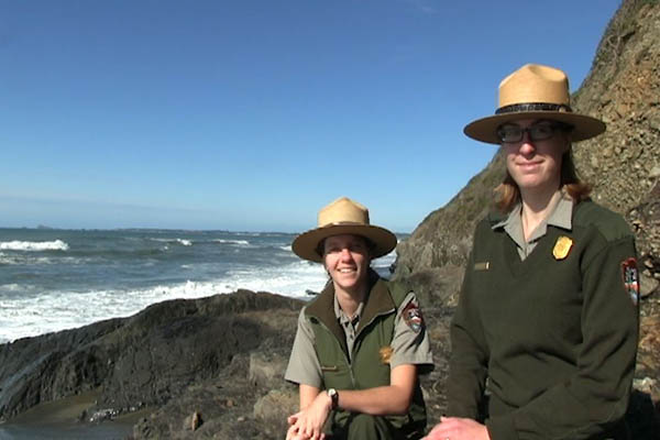 Two rangers on the coast.