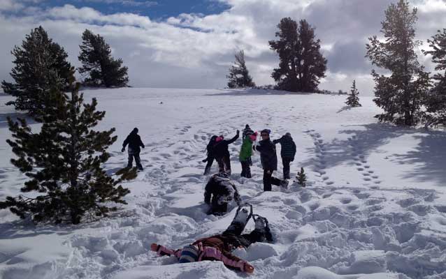 Kids on a hillside, playing in the snow. Kids on a hillside, playing in the snow.