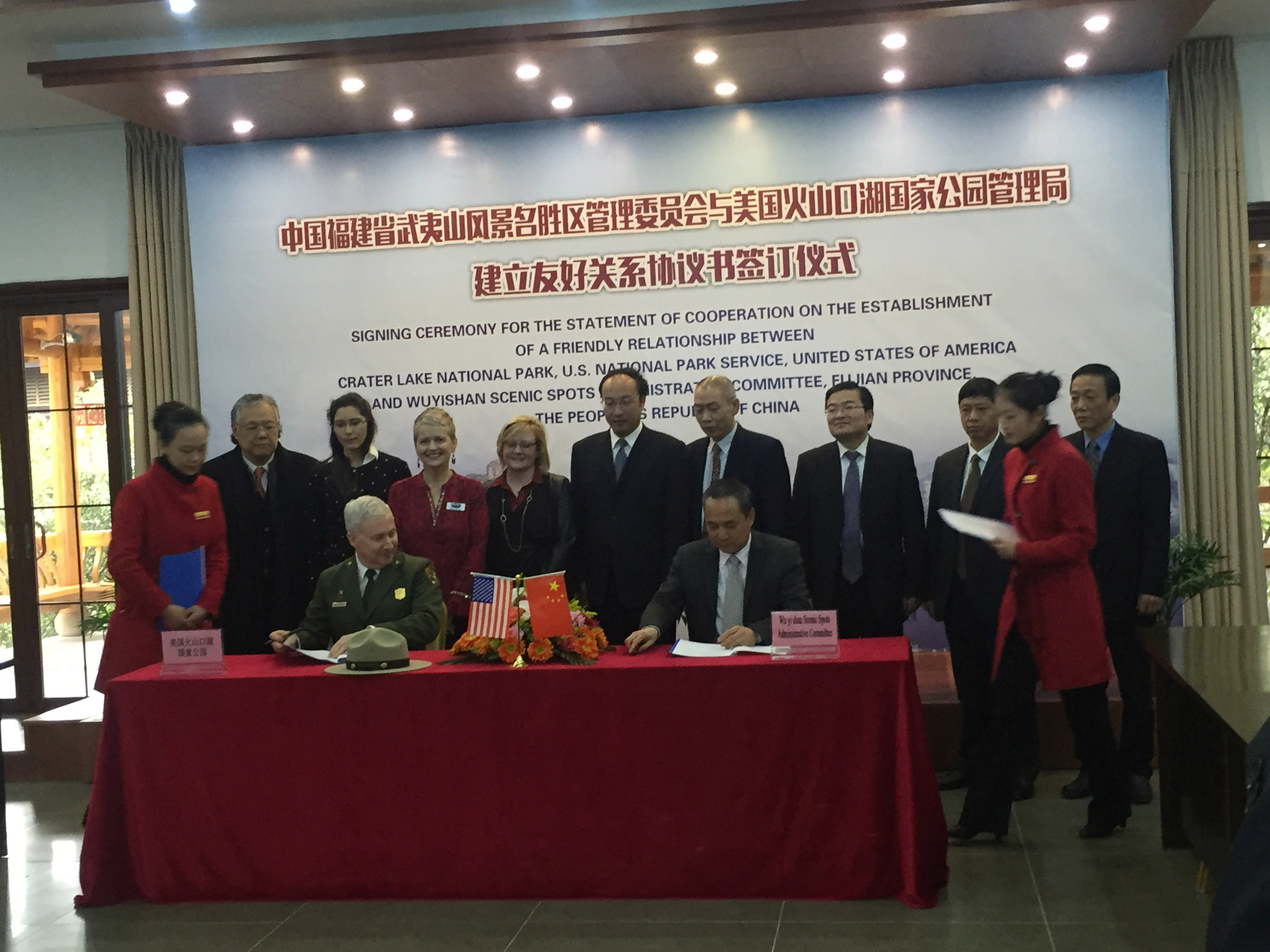 Crater Lake National Park Superintendent Craig Ackerman signs sister park agreement with Wuyishan National Scenic Area in China