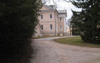 Driveway leading to a historic mansion.