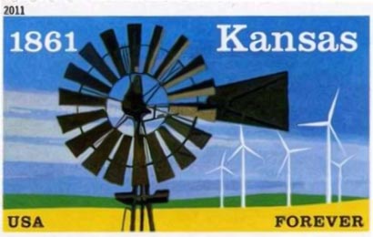 Image of a postage stamp with a windmill in the foreground, wind turbines in the background, the words Kansas, USA, and Forever, and the date 1861. 