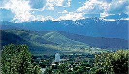 This is an image of Baker City, Oregon, with mountainous terrain in the background. Photo: Courtesy, Oregon State Historic Preservation Office.