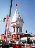 This is an image of the replacement cupola clock tower being hoisted into place. Photo: Courtesy, Sidway Investment Corp.