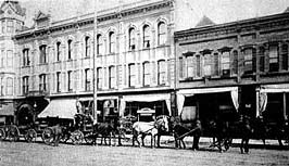 This is an image of the Geiser Grand Hotel and adjacent streetscape, ca. 1900. A horse-drawn carriage is in the foreground. Photo: Courtesy, W. David Samuelson.