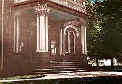 This is an early color postcard image of the original Jackson County Courthouse entry porch, a highly ornate, flat-roofed feature. Photo: Courtesy, George Kramer.