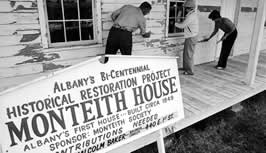 This is an image of ongoing exterior restoration work at the Monteith House in the 1970s. Photo: Stanford Smith/Albany Democrat Herald/Albany Regional Museum.
