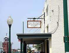 This is an image of a compatible new sign in downtown Grapevine, Texas, a local historic district. Photo: Hugo Gardea.
