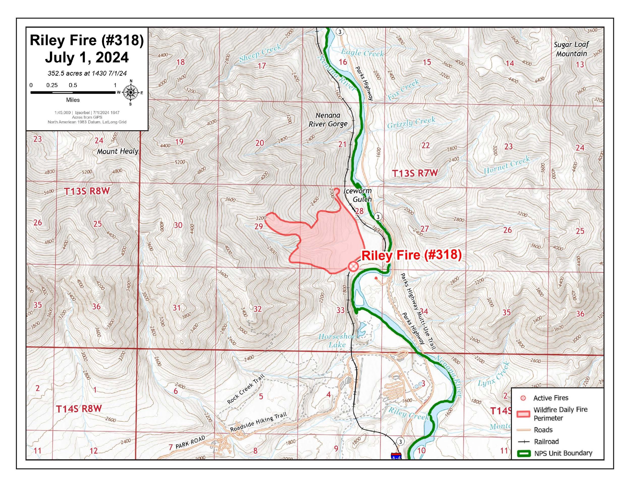 A topographic map of the park entrance area to the south and Nanana River Gorge to the north. A red shape marks the fire location just west of the railroad tracks across the Nenana River from a commercial area.