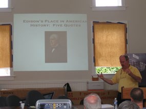 Professor Bernie Carlson speak with a group of volunteers about Thomas Edison.