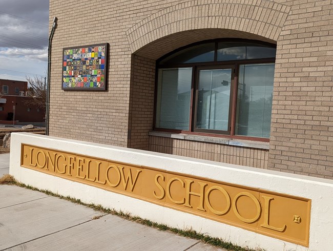 Mosaics on the corner of the Longfellow Elementary School building.