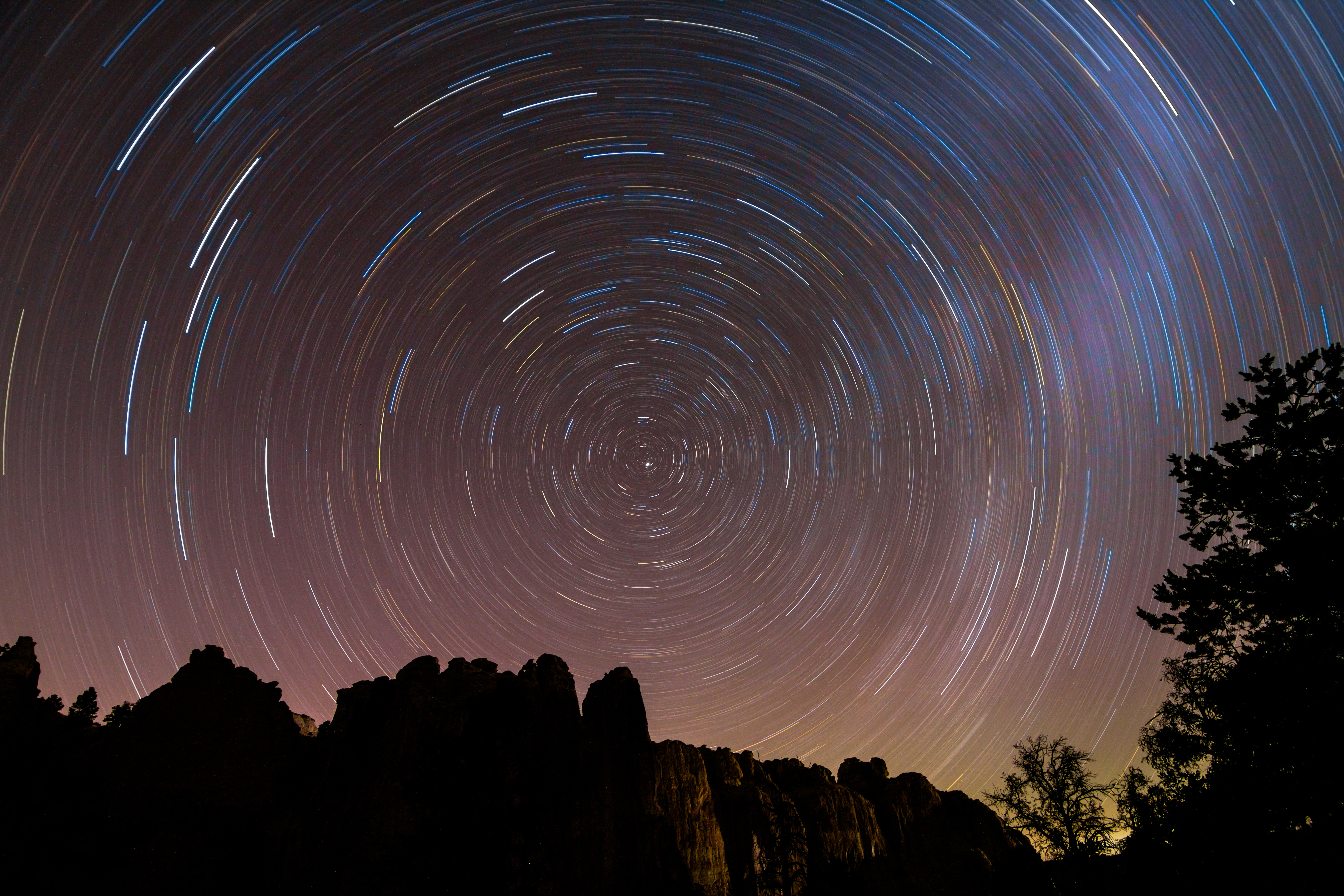 Star trails swirl above Inscription Rock in El Morro National Monument