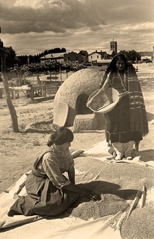 old black and white picture of two women working with wheaton a