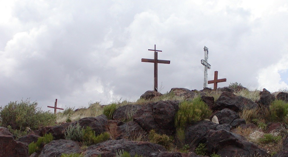 image of three crosses on top of a hill