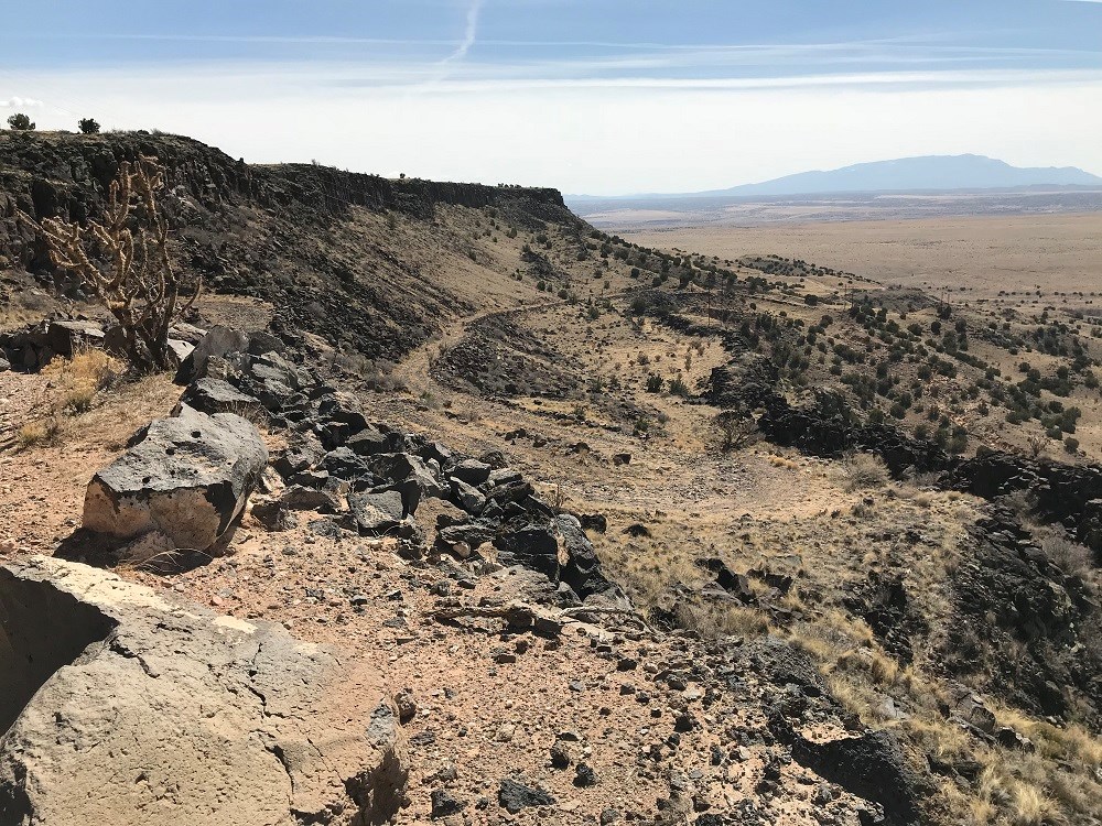 dirt road and mountains with rocks at Bajada Mesa