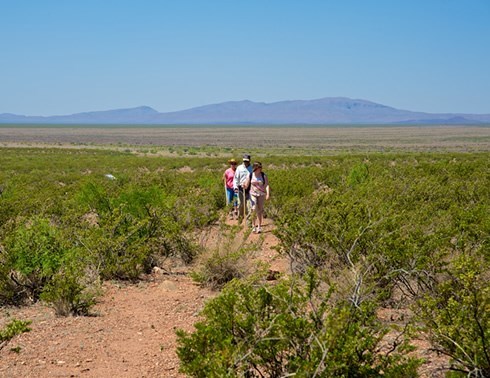 hikers walking a trail in yost draw