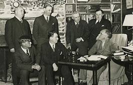 FDR and his Cabinet conducting a meeting.