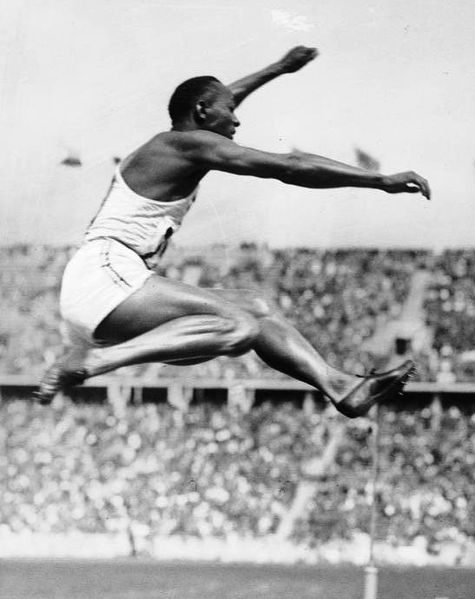 Jesse Owens, mid air, during his victorious long jump at the Berlin Olympics.