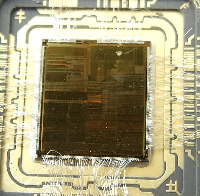 Exposed semiconductor die woven into external leads.