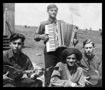 Three men playing music on various instruments.