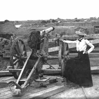 Lou Henry Hoover beside a cannon.