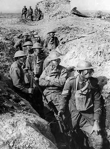 Soldiers wearing gas masks in a trench during World War I.