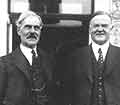 Ramsay MacDonald standing with Herbert Hoover.