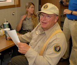 A park volunteer smiles for the camera.