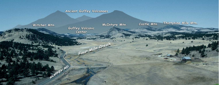 View of flat valley and mountains in distance with drawing depicting ancient volcano