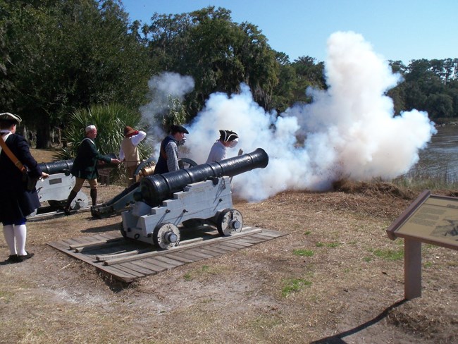 Image of park workers shooting the cannon