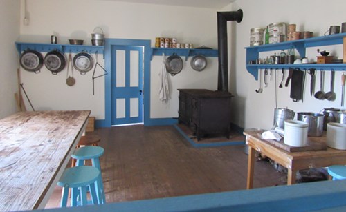 The kitchen in the enlisted barracks, complete with a cast iron stove.