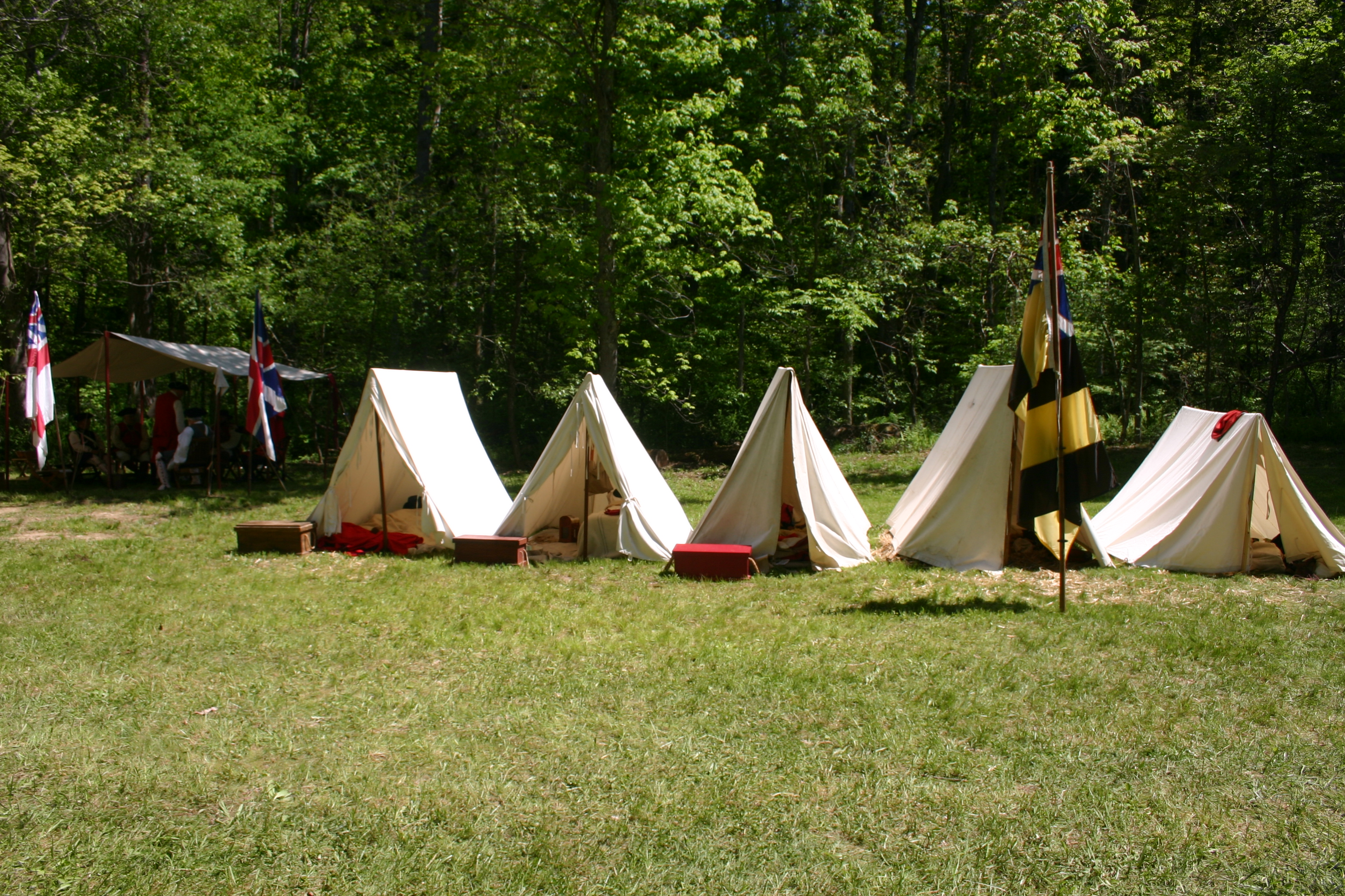 Row of canvas tens in a field