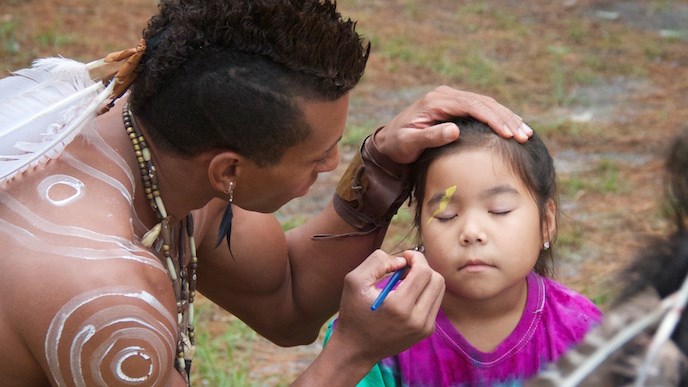 Visitor getting her face painted during the Virginia Dare Faire