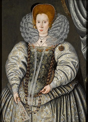 A painting of a woman with red hair and very pale skin. She is wearing an ornate dress with puffy shoulders, a large lace collar, and several pearl necklaces