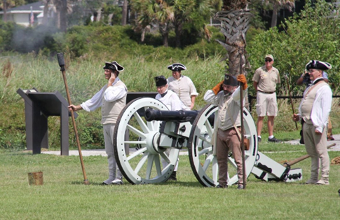 Patriot crew firing a cannon