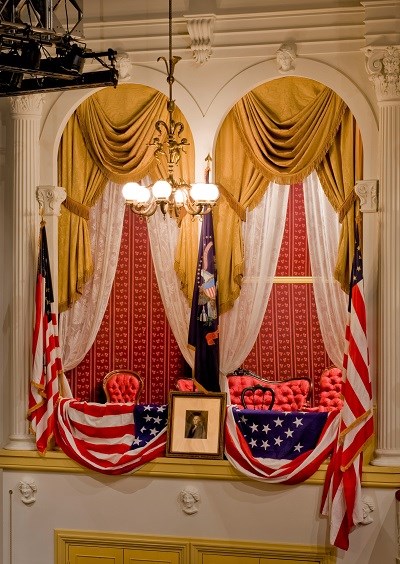 Theatre Seating Box elaborately decorated with flags, draperies, and a portrait of Washington