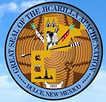 Jicarilla Apache Seal showing images of tipis, arrow and profile of Jicarilla Apache tribal member