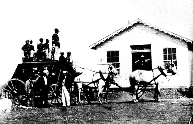 buffalo soldiers riding atop stagecoach