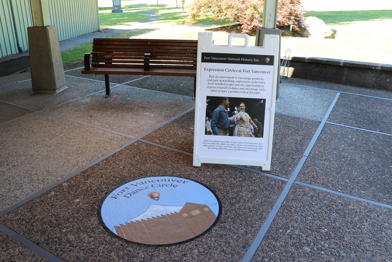 A decal on the ground outside the Fort Vancouver Visitor Center with text reading Dance Circle.
