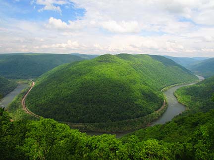 River cutting through a deep, forested gorge