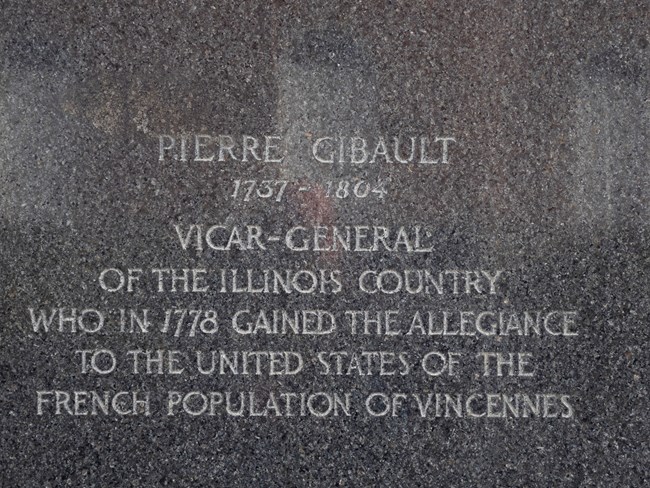 Carved in black stone: Pierre Gibault, 1737 to1804, Vicar General of the Illinois Country who in 1778 gained the allegiance to the United States of the French Population of Vincennes