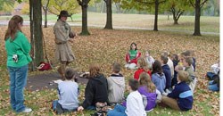 Volunteer at George Rogers Clark speaks with a school group.