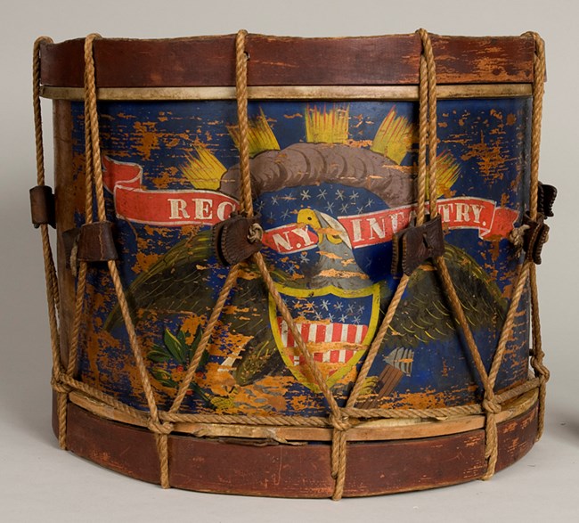 Civil War musician's wooden snare drum. This drum was carried by Henry Mayo of Company F, 147th NY Infantry. A colorful snare drum
