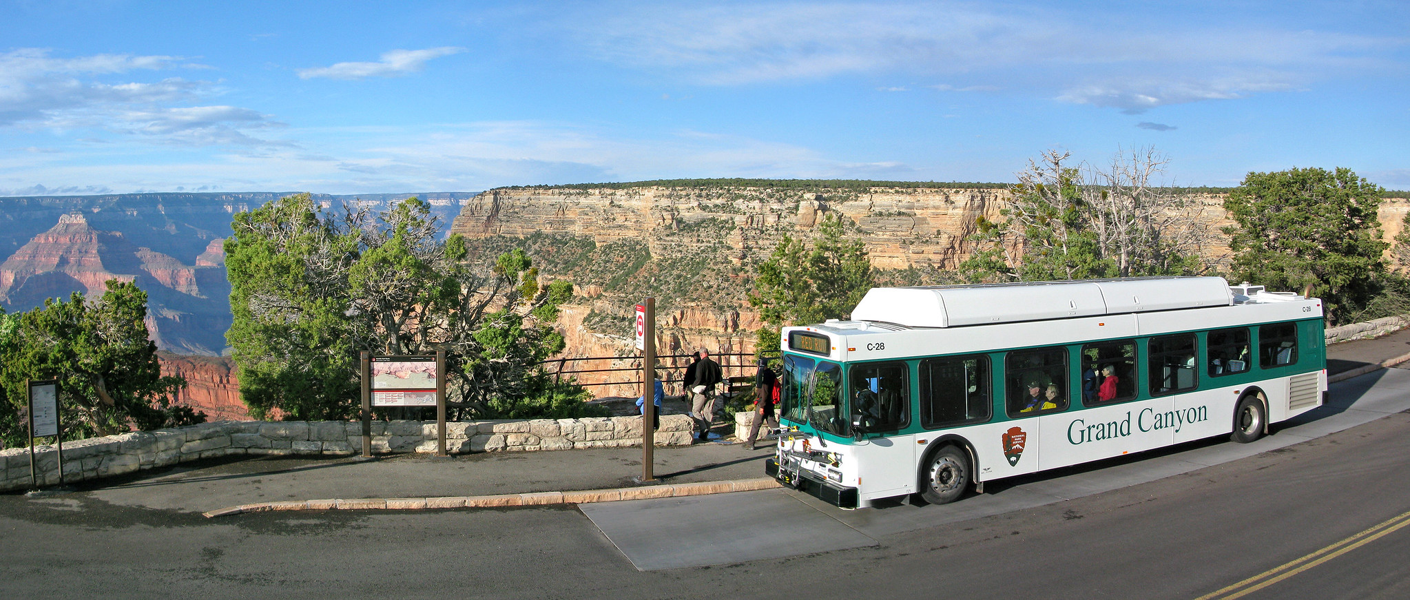 A Grand Canyon shuttle is stopped at Monument Creek Vista along the Hermit Road