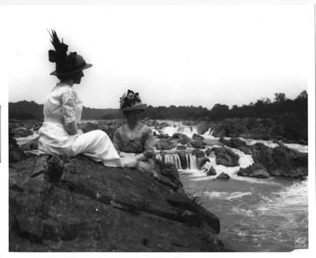 Two women view the falls in the 1920s.