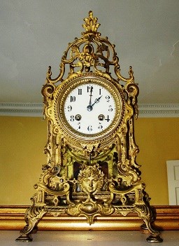 A gold, ornate clock.