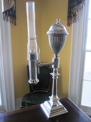 A silver plated oil lamp