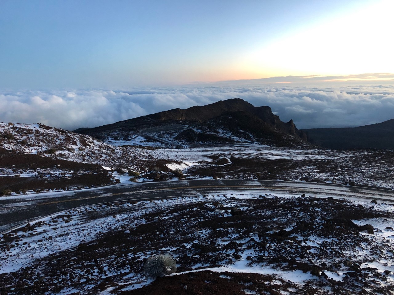 Snow and ice fall appear on rugged volcanic crater