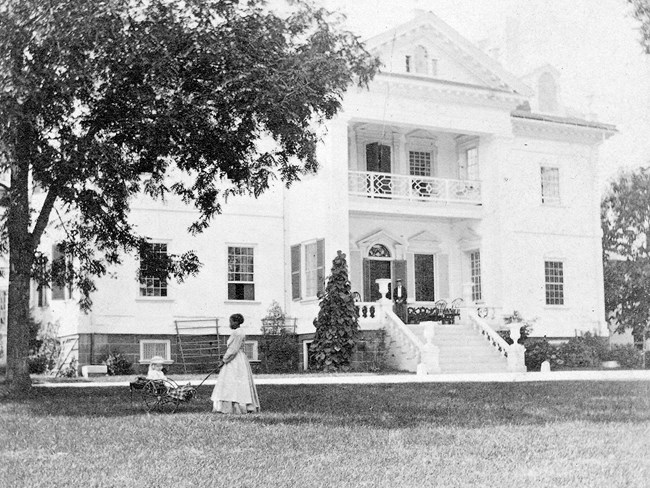 Stereograph of Nancy Davis in front of Mansion, 1872 NPS